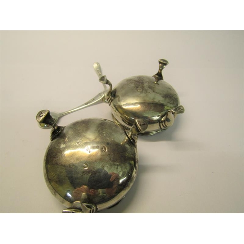 205 - A pair of silver salt cellars, London 1764 & 1774, with later spoons, each 6cm diam.