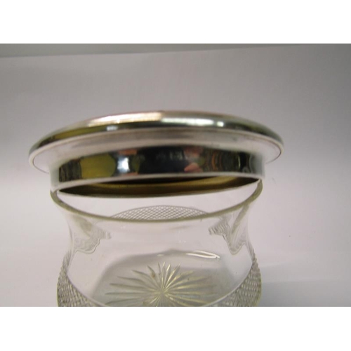 208 - An Art Deco period cut glass powder pot with a silver and enamel lift off cover, makers mark for Adi... 