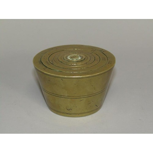 35 - A set of 19c brass cup weights, graduated in troy ounces from 18 to 1 1/4oz. 7cm diam, 4.25cm h.