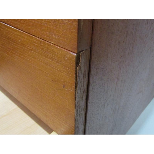 451 - A 1970's Stag teak sideboard fitted four short drawers and cupboard with fitted pull out cutlery tra... 