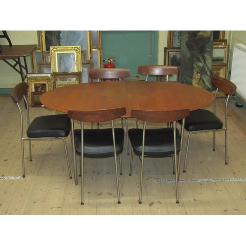 453 - A 1970's Stag teak oval dining table supported on four straight slightly splayed aluminised legs, to... 