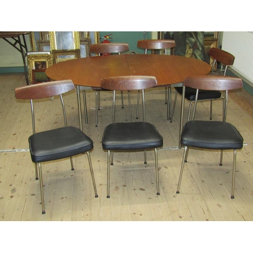 453 - A 1970's Stag teak oval dining table supported on four straight slightly splayed aluminised legs, to... 