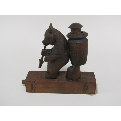 48 - An early 20c Black Forest carved wood bear novelty in the form of a grape picker with a China man in... 