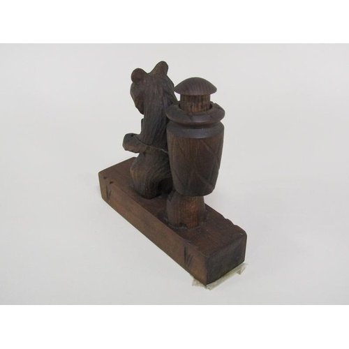 48 - An early 20c Black Forest carved wood bear novelty in the form of a grape picker with a China man in... 