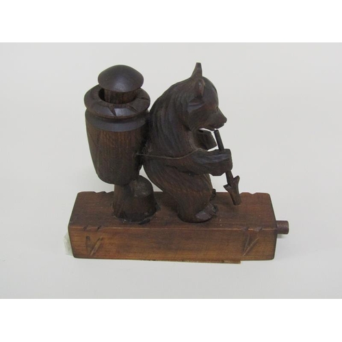 48 - An early 20c Black Forest carved wood bear novelty in the form of a grape picker with a China man in... 