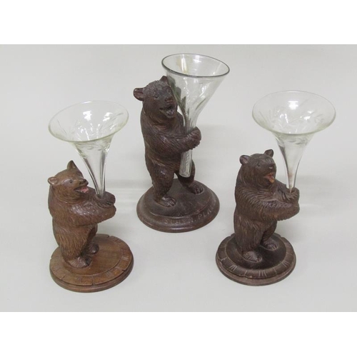 51 - Three late 19c/early 20c Black Forest carved wood bear posy holders, 12cm to 15cm h.