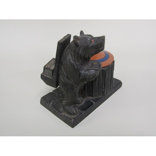 52 - A late 19c/early 20c Black Forest carved wood bear smokers stand, the bear supporting a matchbox hol... 