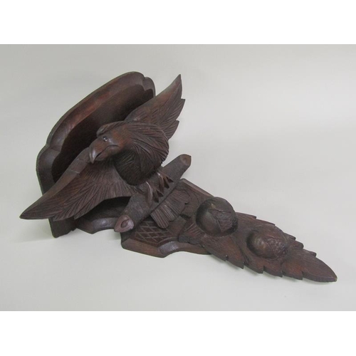 57 - A pair of late 19c/early 20c carved wood eagle wall brackets, 49cm h.  The brackets 32cm w.