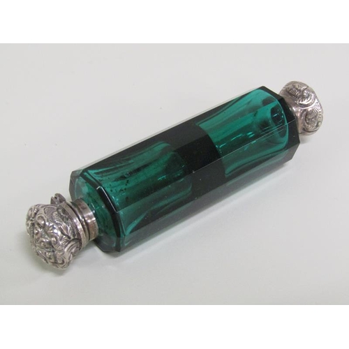 83 - A late 19c green cut glass double ended scent bottle with silver hinge covers and mounts together wi... 