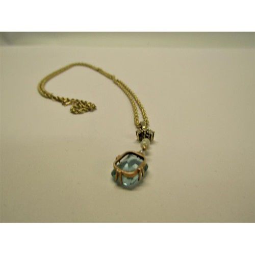 133 - A gold pendant set with square Aquamarine suspended by seed pearls and diamonds on a 9ct chain, 3.7g... 