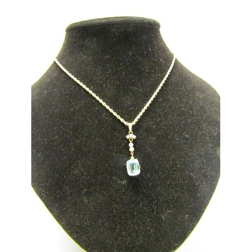 133 - A gold pendant set with square Aquamarine suspended by seed pearls and diamonds on a 9ct chain, 3.7g... 