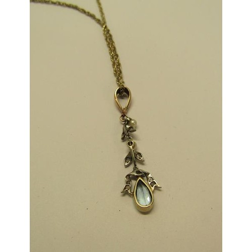 134 - A Edwardian 9ct gold drop aquamarine pendant set with suspended cut white garnet stones and seed pea... 