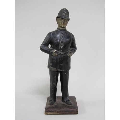 1337 - CAST METAL AND PAINTED POLICEMAN NOVELTY LIGHTER, STRIKE MISSING, 22.5CM H