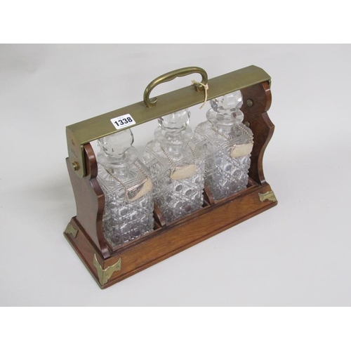 1338 - THREE BOTTLE TANTALUS WITH SILVER LABELS, 37CM W, 15cm deep, 31cm h