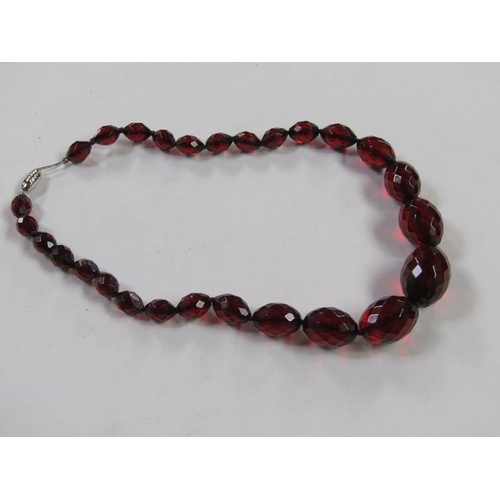 1413 - CUT RED AMBER TYPE BEAD NECKLACE TOGETHER WITH BLUE STONE SET SILVER MOUNTED PENDANT AND CHAIN