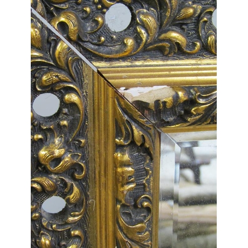 1009 - MOULDED GILT FRAMED WALL MIRROR, 70 x 59 cms