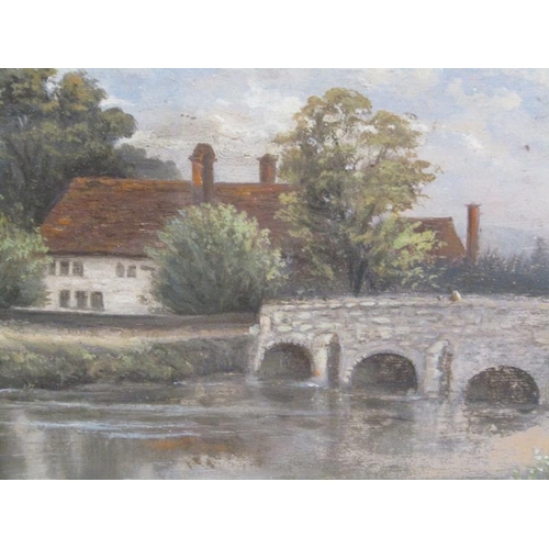 1026 - S LANGFORD 1902 - COTTAGE AND STONE BRIDGE OVER THE RIVER, OIL ON BOARD.  F/G 16 x 29cms