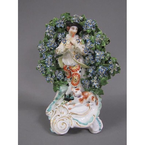 228 - A pair of Chelsea bocage figures of a shepherd and shepherdess, in gilt and floral costumes, a dog a... 