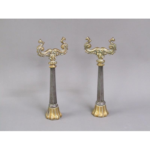 26 - A pair of 19c brass and steel andirons, the scrolling brass rests supported on facet tapering steel ... 