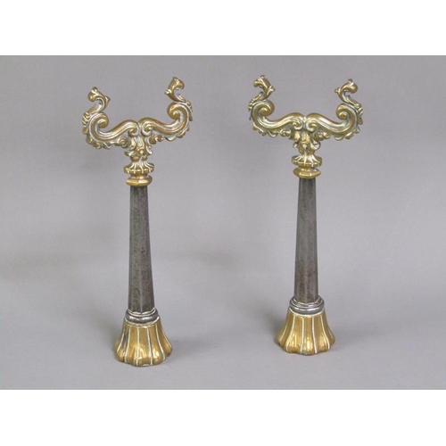 26 - A pair of 19c brass and steel andirons, the scrolling brass rests supported on facet tapering steel ... 