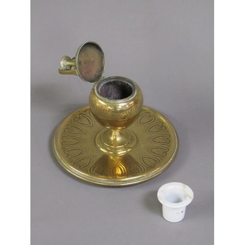 27 - A Victorian brass inkwell of ovoid form with a hinged domed cover supported on a circular base, lapp... 