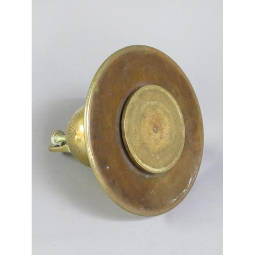 27 - A Victorian brass inkwell of ovoid form with a hinged domed cover supported on a circular base, lapp... 