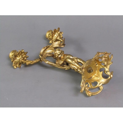 28 - A pair of late 19c rococo ormolu figurative two branch candelabra with cherub columns, 28cm h.