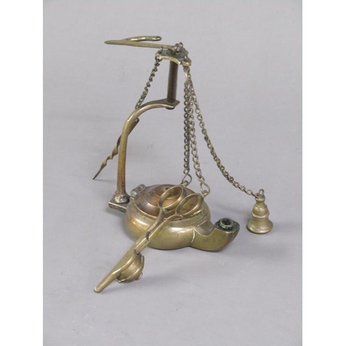 31 - A Continental brass hanging floating wick lamp with three suspended chained tools, 17cm h.