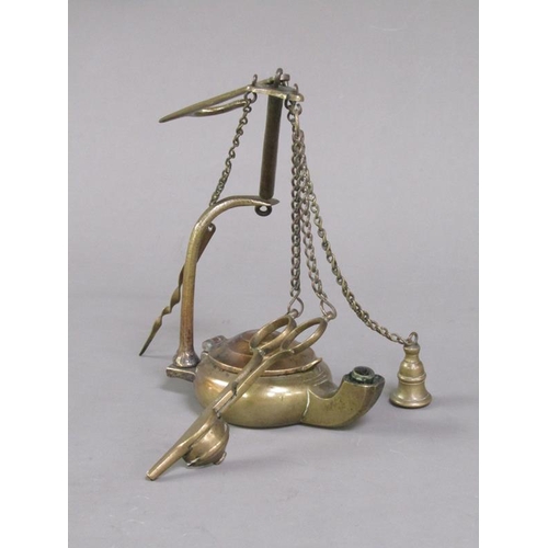 31 - A Continental brass hanging floating wick lamp with three suspended chained tools, 17cm h.