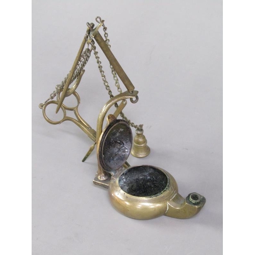 31 - A Continental brass hanging floating wick lamp with three suspended chained tools, 17cm h.