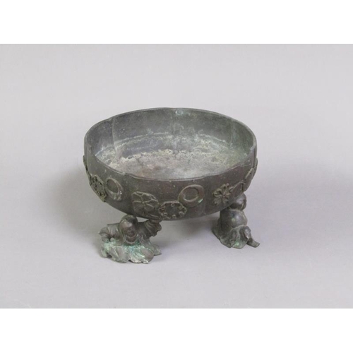 33 - A 19c Oriental patinated bronze censer in the form of a bowl, cast with flowers and crescents, suppo... 