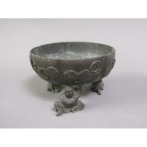 33 - A 19c Oriental patinated bronze censer in the form of a bowl, cast with flowers and crescents, suppo... 