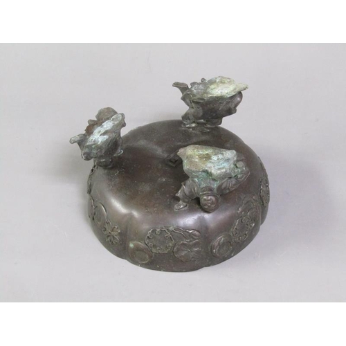 33 - A 19c Oriental patinated bronze censer in the form of a bowl, cast with flowers and crescents, suppo... 