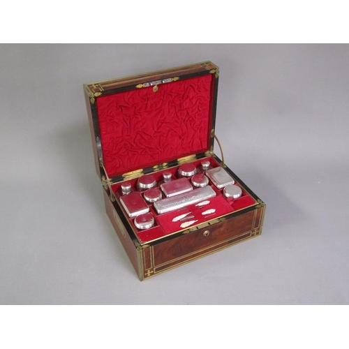 42 - A George III figure mahogany travelling box with brass edging, line inlay and motifs, fitted with th... 