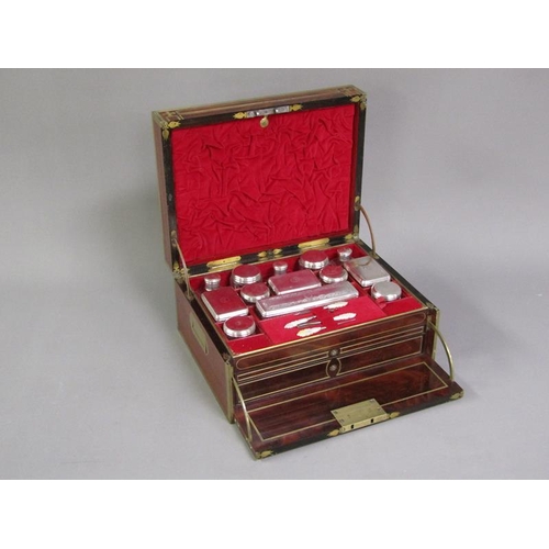 42 - A George III figure mahogany travelling box with brass edging, line inlay and motifs, fitted with th... 