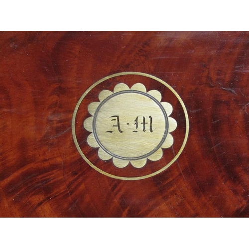 42 - A George III figure mahogany travelling box with brass edging, line inlay and motifs, fitted with th... 