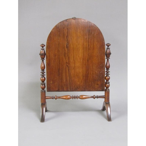 47 - A Regency period rosewood toilet glass, the arched mirror with a line inlaid border, supported on ri... 