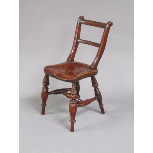 49 - A Victorian miniature fruitwood scroll back Windsor chair, on the under side of the seat an attached... 