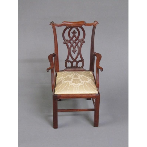 50 - A miniature mahogany open armchair in a mid Georgian style, the pierced vase shaped splat, shaped to... 