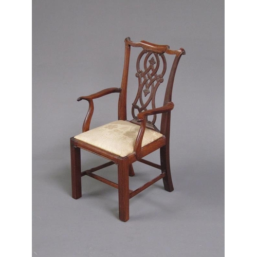 50 - A miniature mahogany open armchair in a mid Georgian style, the pierced vase shaped splat, shaped to... 