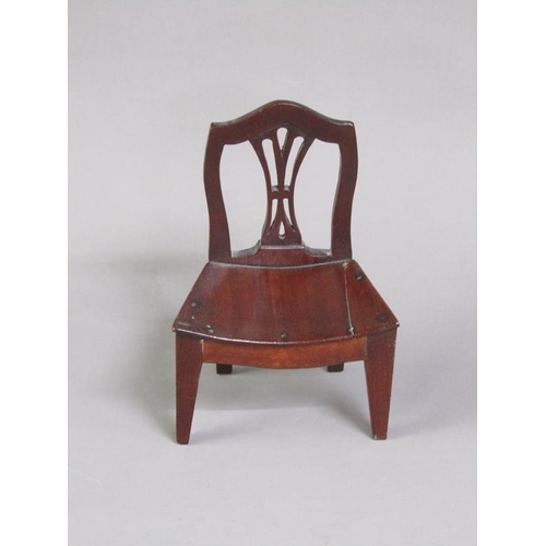 51 - A late Georgian mahogany miniature single chair with a concave solid seat, pierced vase splat, shape... 