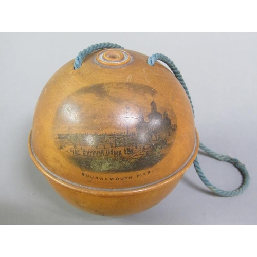 56 - A late 19c Mauchline ware string ball decorated with a transfer of Bournemouth Pier and having a car... 