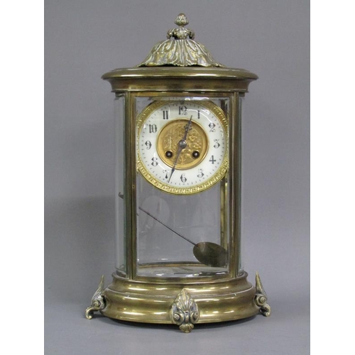 14 - A late 19c French four glass clock in oval brass case with bevelled oval glass side panels and doors... 