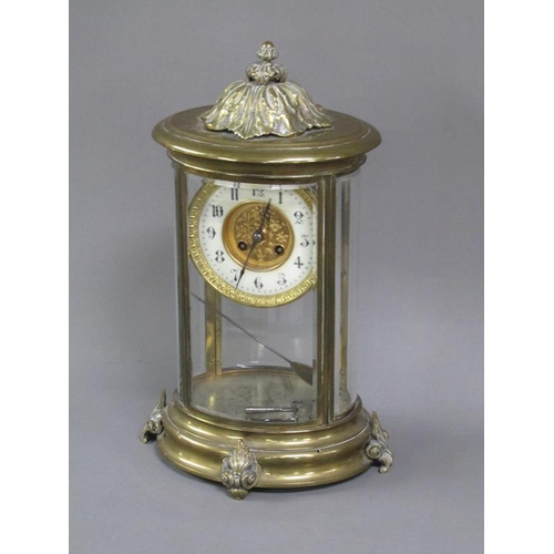 14 - A late 19c French four glass clock in oval brass case with bevelled oval glass side panels and doors... 