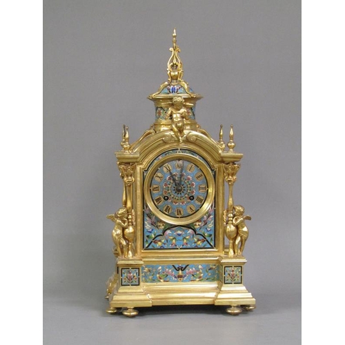 15 - A late 19c French mantel clock in gilt brass case inset with champleve enamel panels.  The Gothic in... 