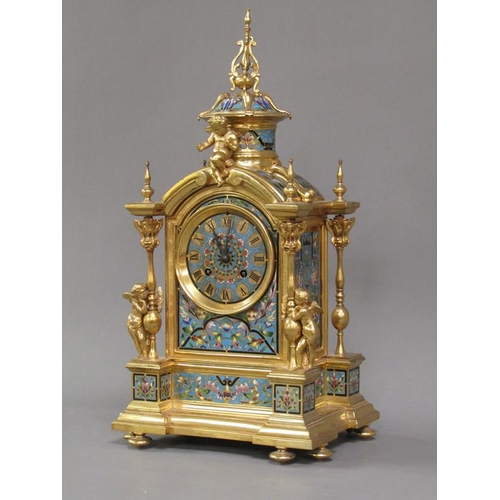 15 - A late 19c French mantel clock in gilt brass case inset with champleve enamel panels.  The Gothic in... 