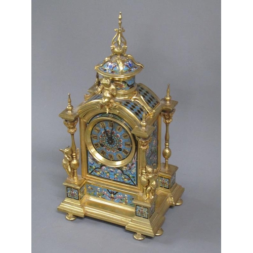 15 - A late 19c French mantel clock in gilt brass case inset with champleve enamel panels.  The Gothic in... 