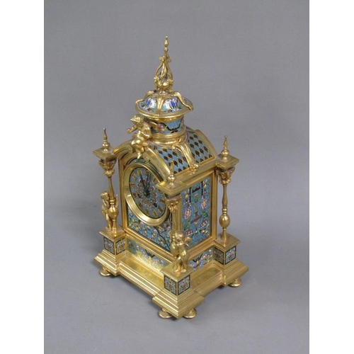 15 - A late 19c French mantel clock in gilt brass case inset with champleve enamel panels.  The Gothic in... 