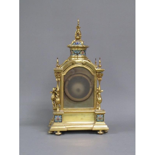 15 - A late 19c French mantel clock in gilt brass case inset with champleve enamel panels.  The Gothic in... 