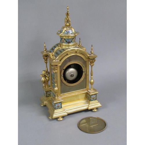 15 - A late 19c French mantel clock in gilt brass case inset with champleve enamel panels.  The Gothic in... 